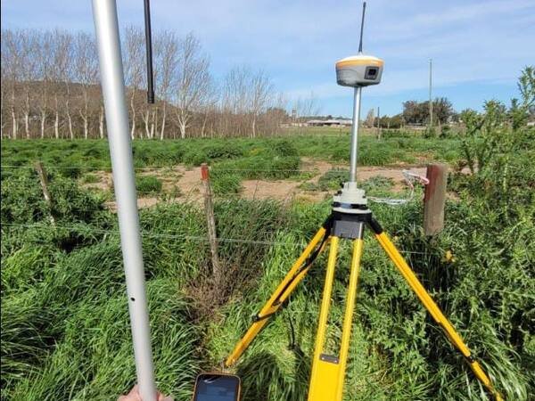 DGPS rover collecting coordinates in farmland
