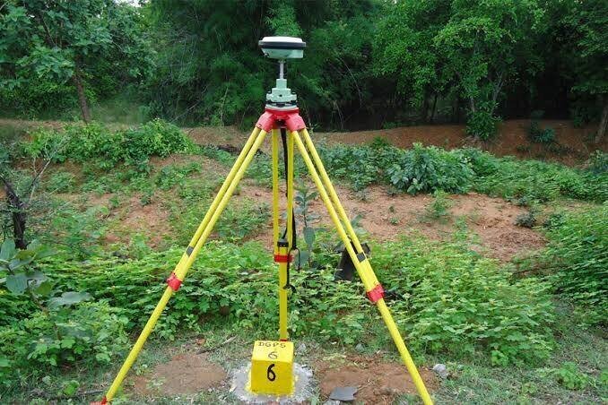 GNSS receiver set up over a control point