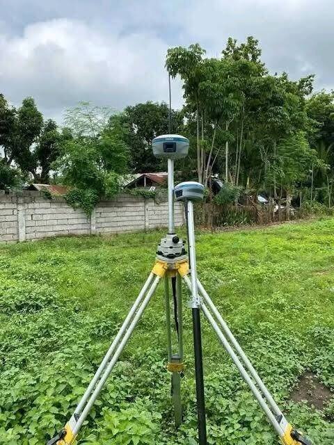 RTK rover positioned on wooded farmland